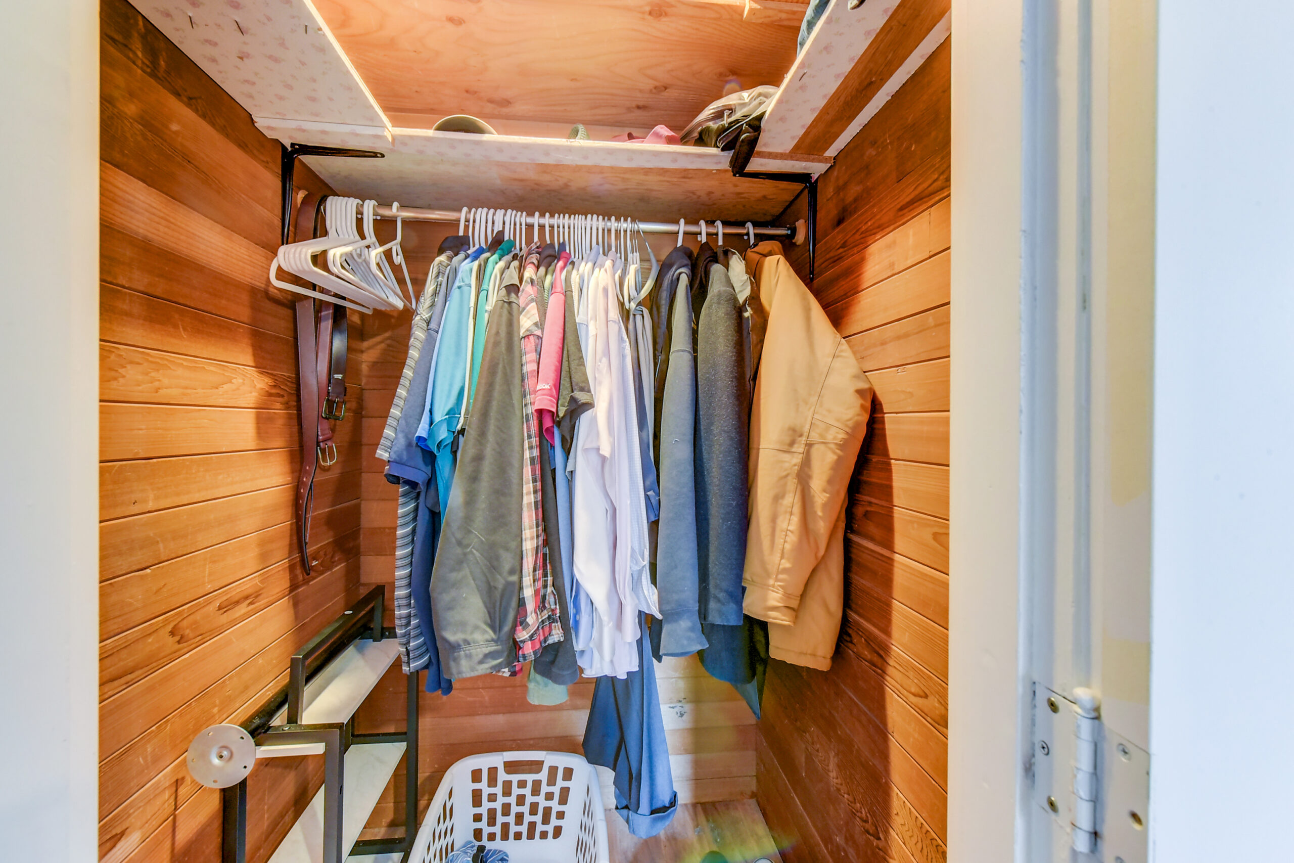 Bedroom closet with hanging rod and shelf at the Everett rambler on Madison St