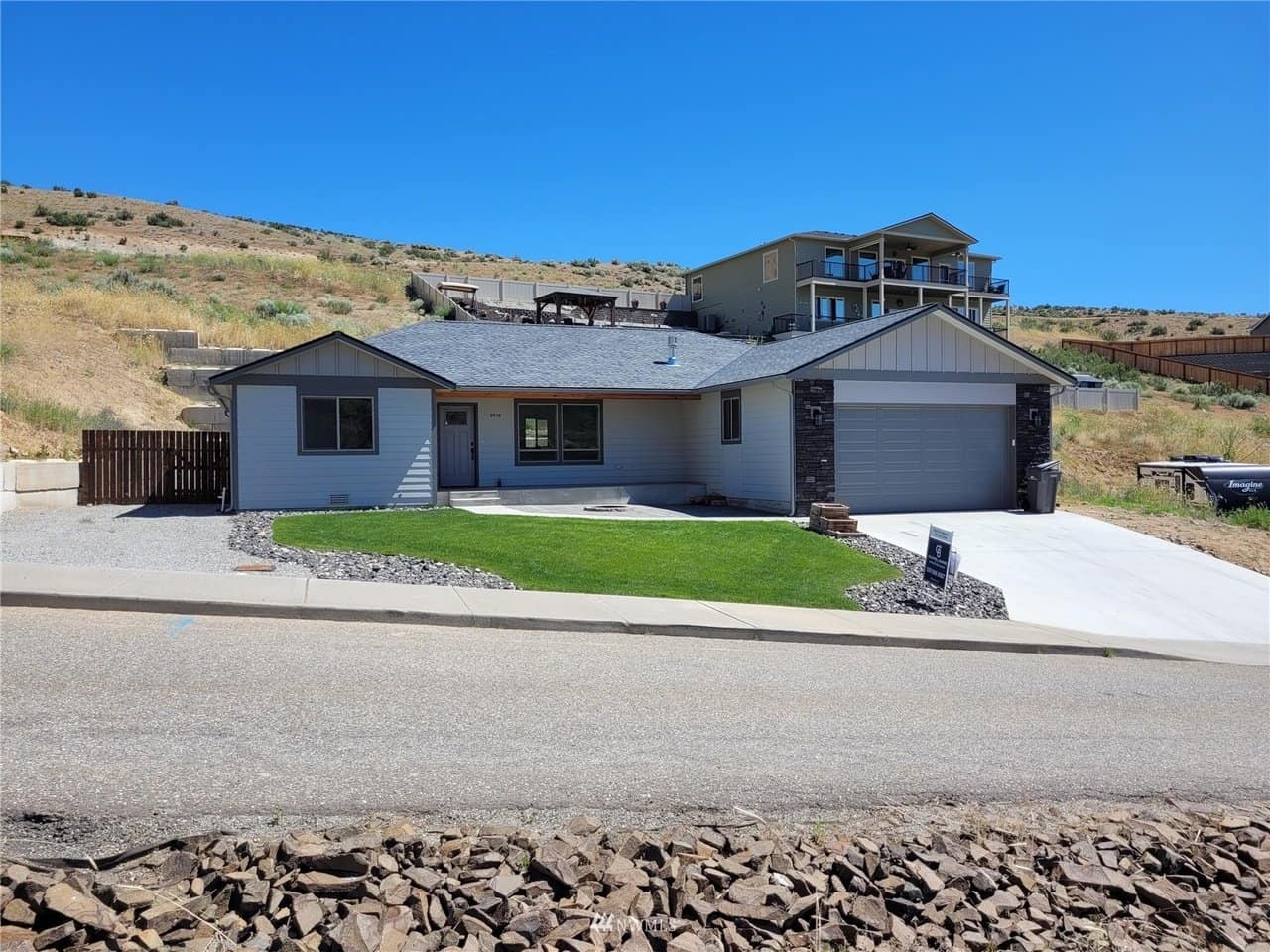Front exterior of Craftsman rambler at 9978 Saska Way, Entiat, with garage and fenced yard