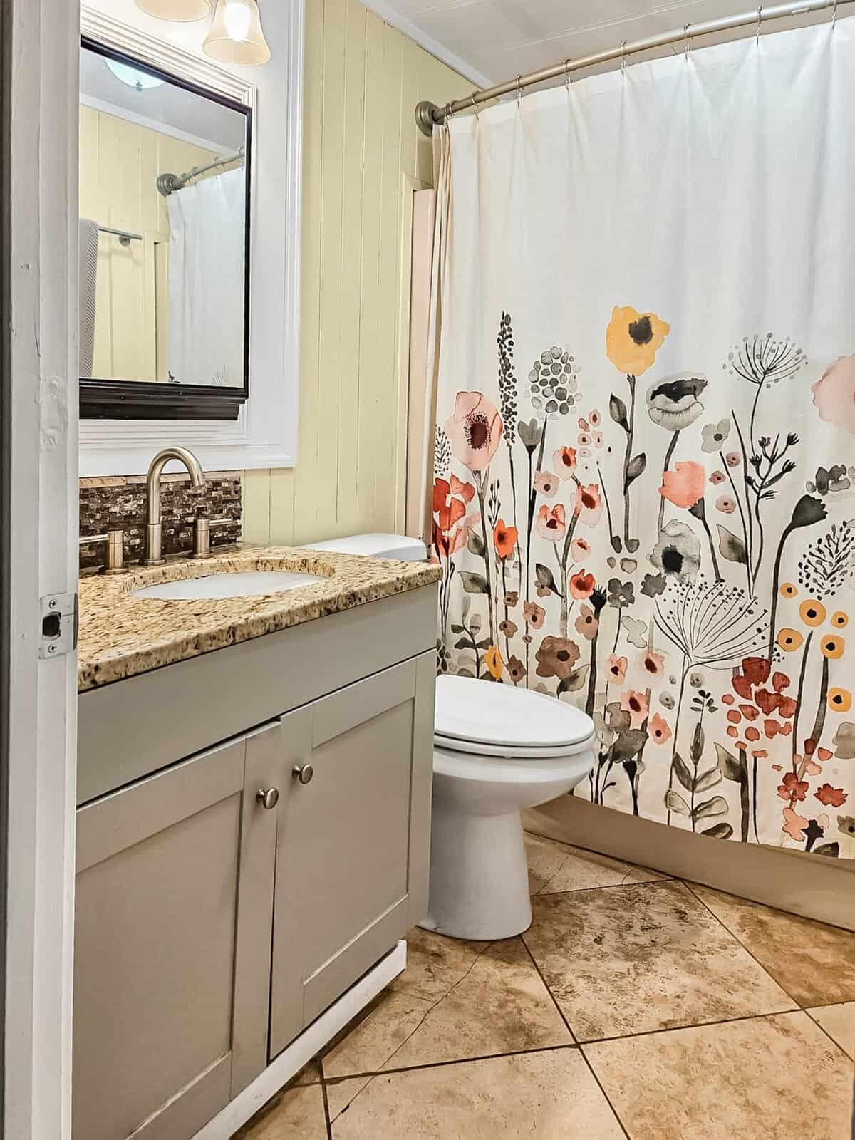 Bathroom with granite vanity, toilet, and shower at the Concrete, WA rent-to-own home