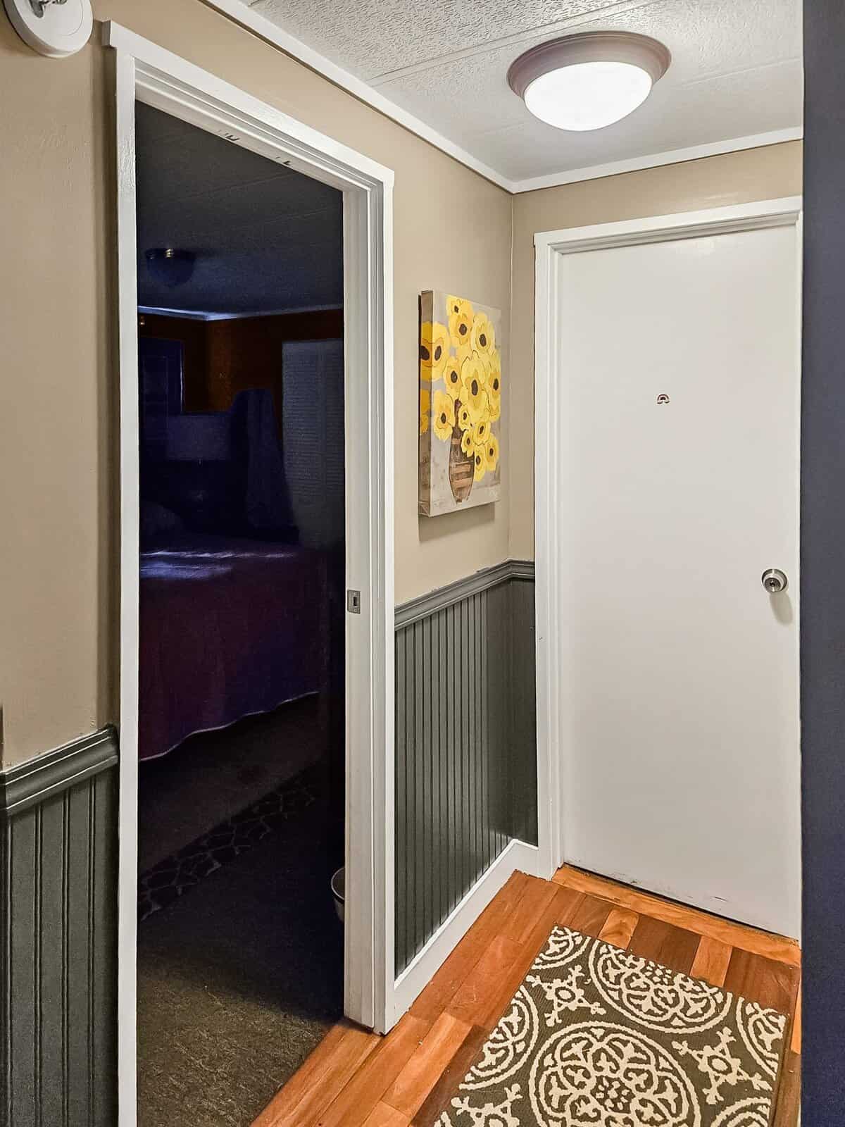 Entryway hallway with front door and bedroom view, Concrete manufactured home