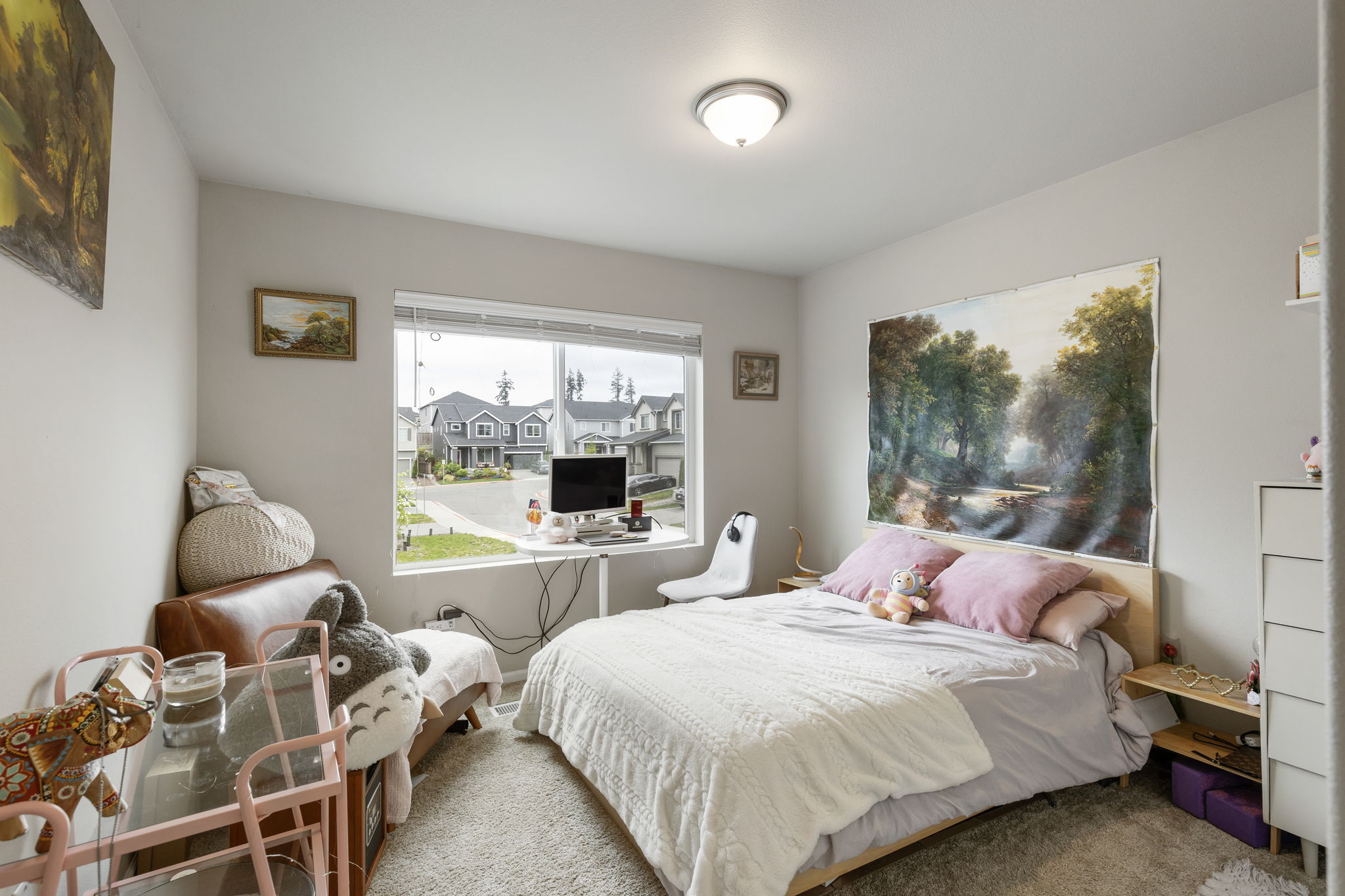 Bedroom with large window and neighborhood view at the Port Orchard rent-to-own home