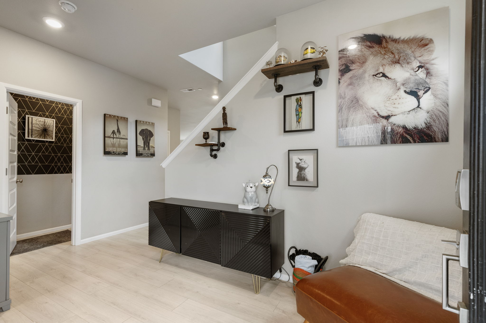Entryway with staircase and safari-themed decor in the Port Orchard rent-to-own home at 962 Thrush Ct SE