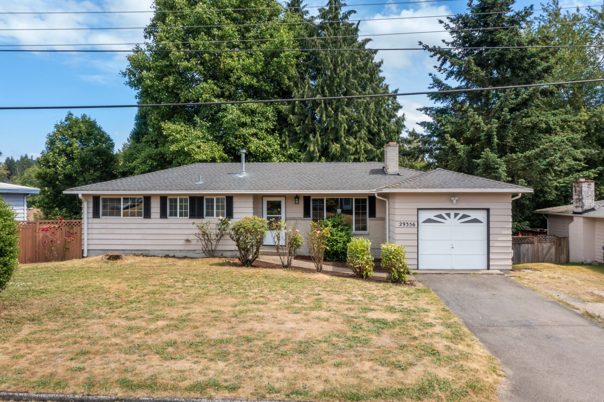Front exterior of the Auburn duplex at 29356 38th Pl S, showing entrance, garage and front yard
