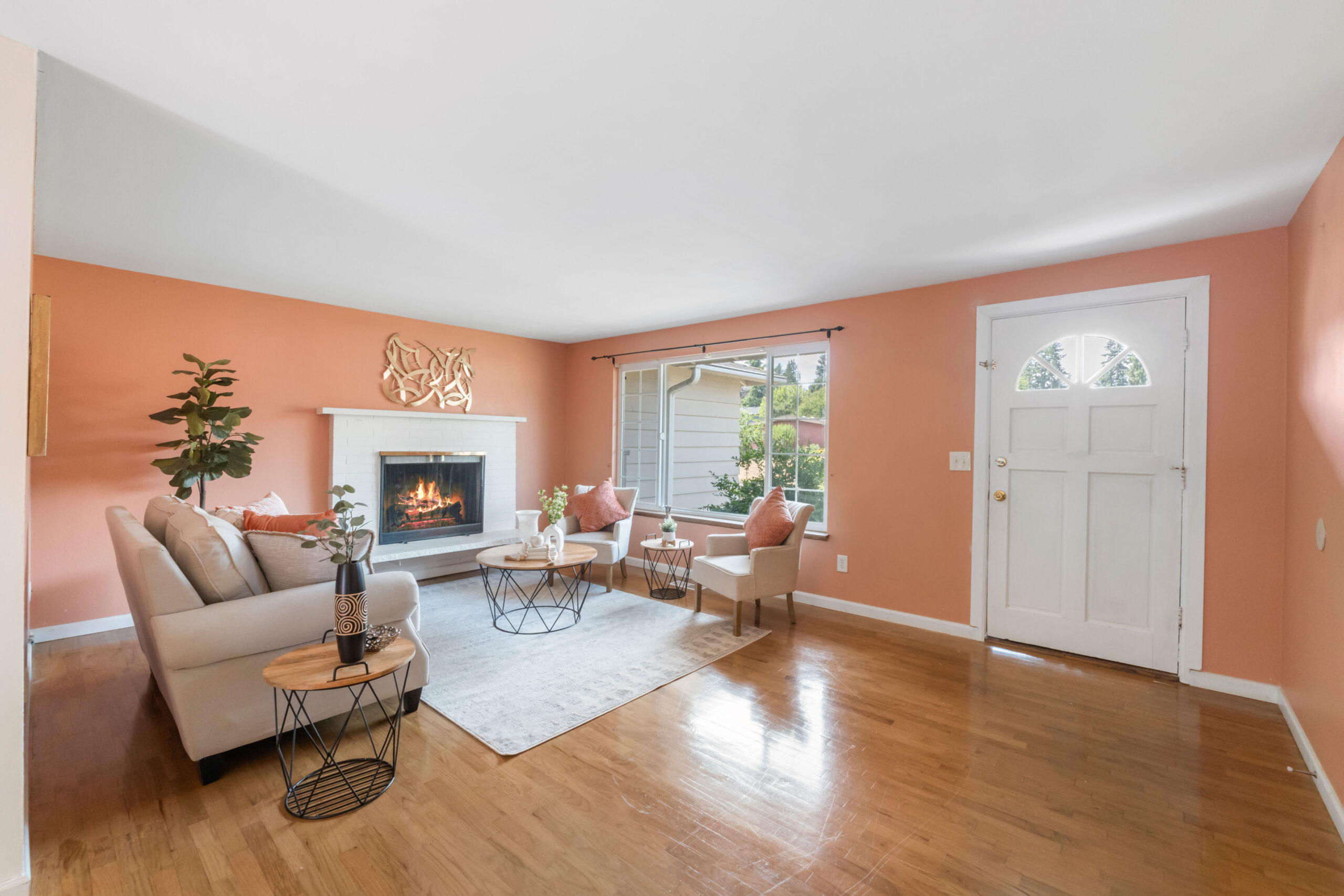Living room with fireplace and hardwood floors in the Auburn duplex's upstairs unit