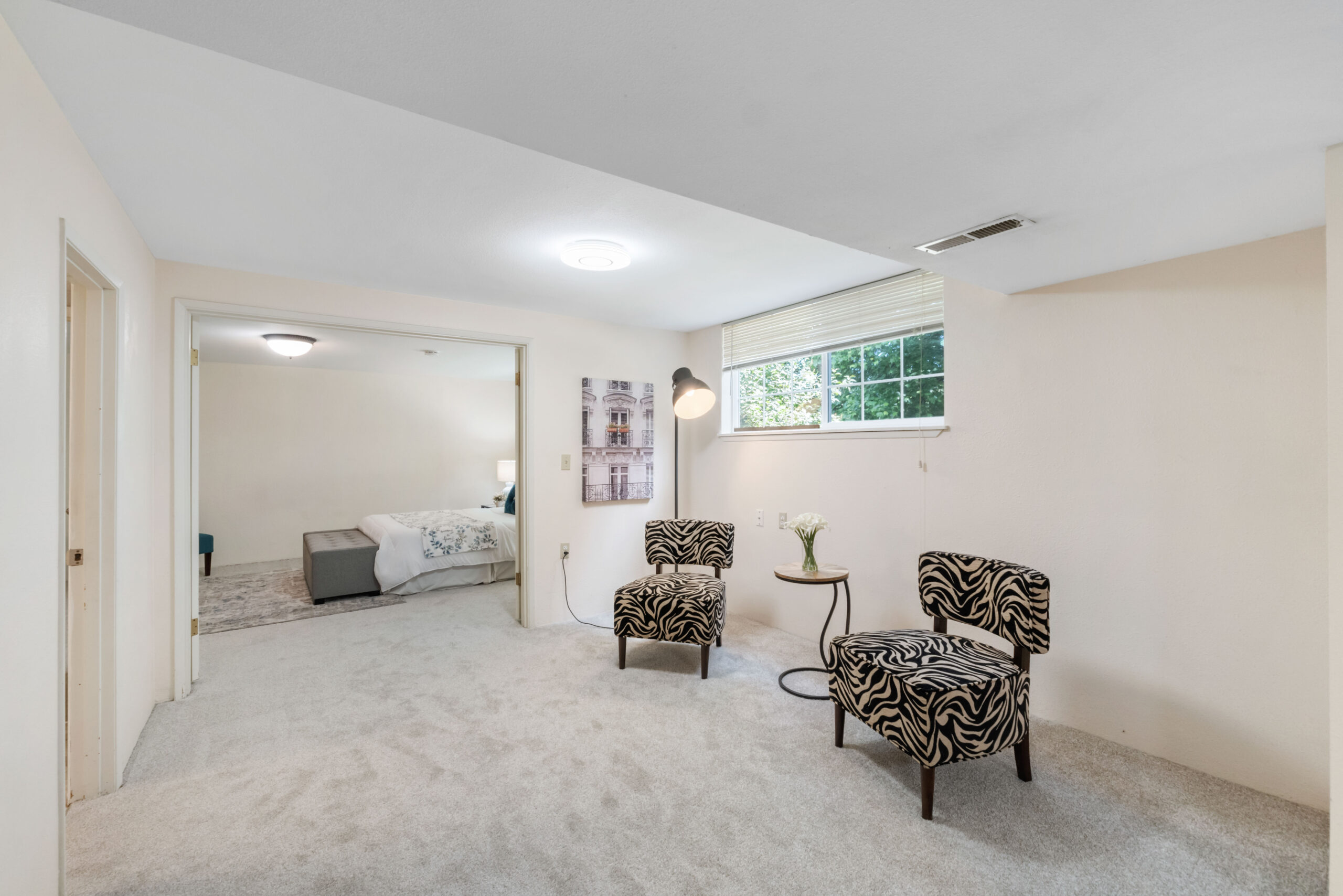 Downstairs unit sitting area opening into bedroom, Auburn duplex lower level