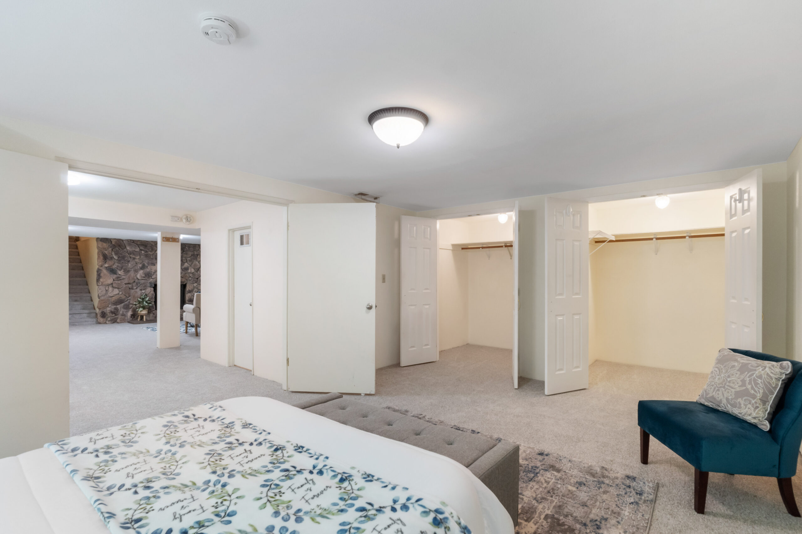 Downstairs unit bedroom with two closets, in the Auburn duplex offered rent-to-own
