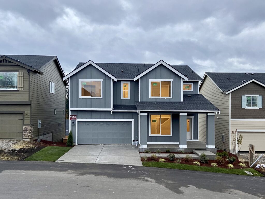 Front exterior of the Thrush Ct rent-to-own home in Port Orchard, two-story with attached garage